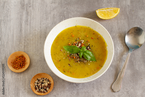 Turmeric and vegetable soup with coconut milk and seeds
