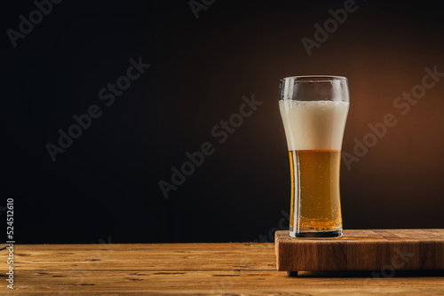 Glass beer on wood board with space for text