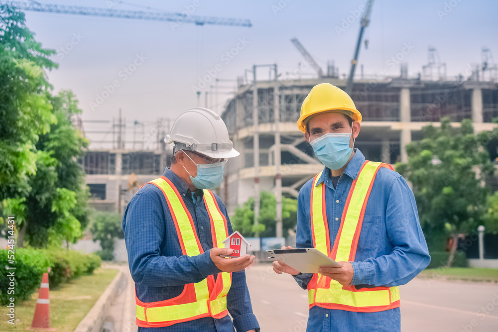 Asian engineer construction team checking work for control and management in the construction site or building site Asian engineer construction team checking work for control and management in the construction site or building site