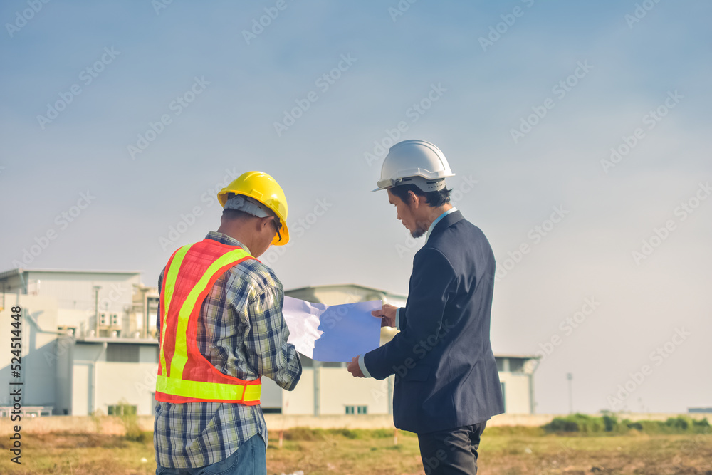 Team Asian man architect on a building construction site Team Asian man architect on a building construction site
