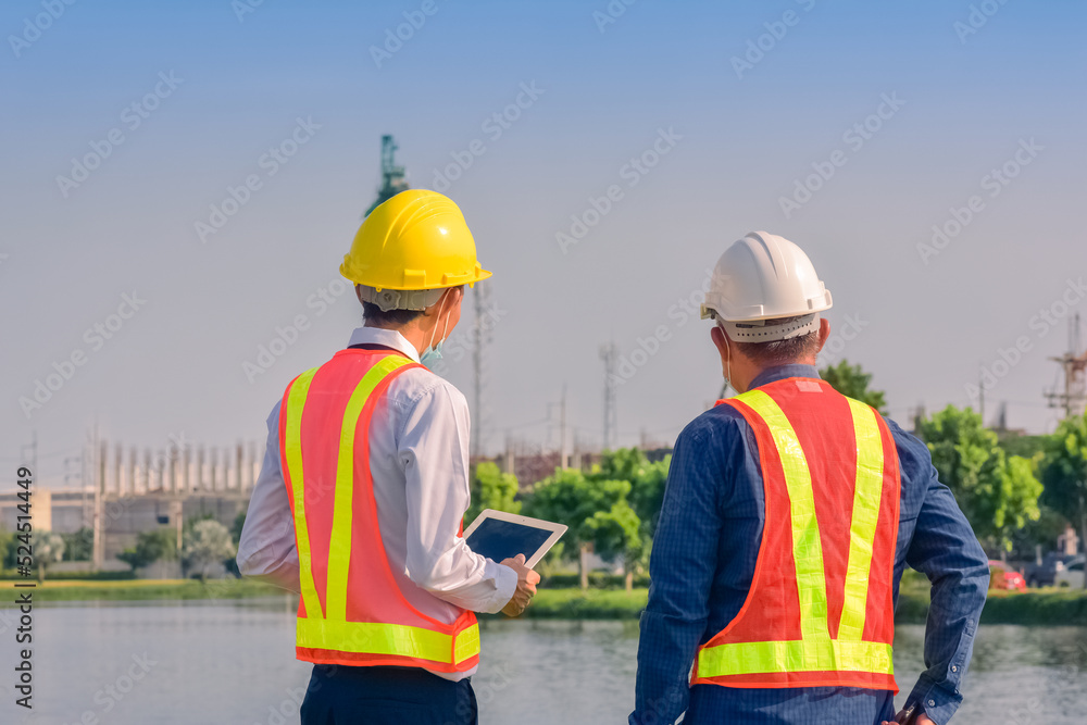 Team Asian man architect on a building construction site Team Asian man architect on a building construction site