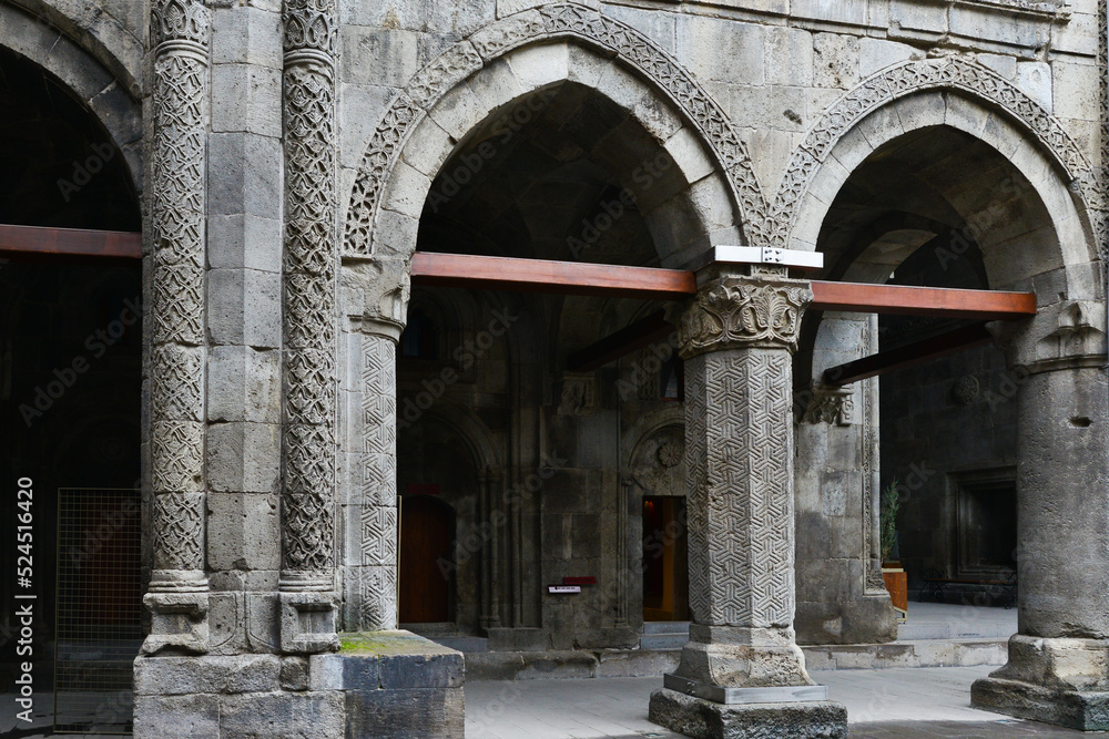 Twin Minaret Madrasah and Turkish flag in Erzurum , Turkey - The madrasah was built in 1271 by Khudavand Khatun, the daughter of Seljuq Sultan Kayqubad I. Twin Minaret Madrasah and Turkish flag in Erzurum , Turkey - The madrasah was built in 1271 by Khudavand Khatun, the daughter of Seljuq Sultan Kayqubad I.