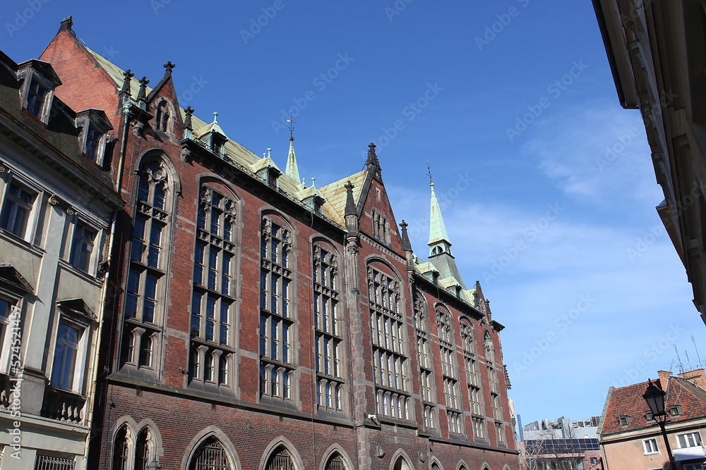 old town hall building with a clock in the center on Wroclaw Square Poland