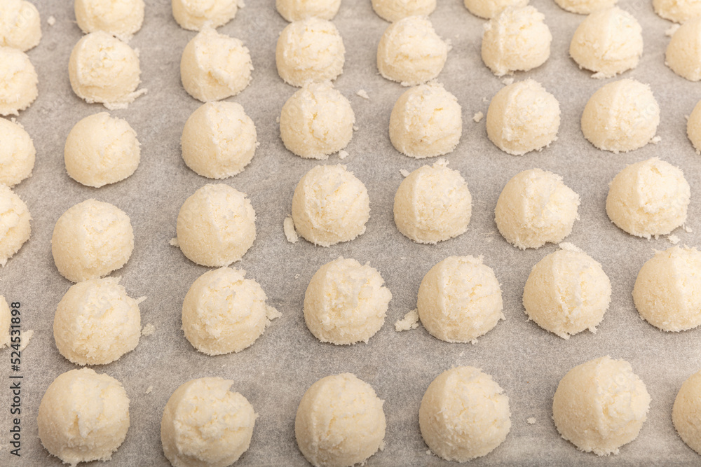 Cakes on automatic conveyor belt or line, baking process in confectionery factory. Food industry, cookie production. Cakes on automatic conveyor belt or line, baking process in confectionery factory. Food industry, cookie production.