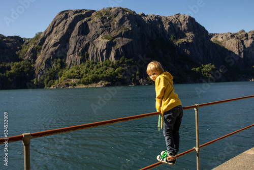 Happy people, enjoying amazing views in South Norway coastline, fjords, lakes, beautiful nature