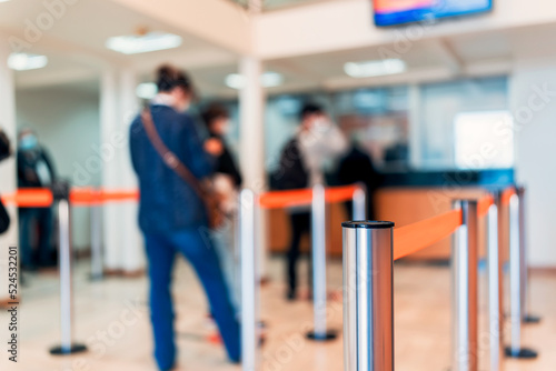 row of people to the bank teller cashier defocused background photo