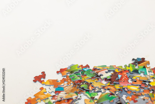 Isolated colourful puzzle pieces with copy space on white background