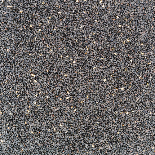 Black sesame seeds - top view. Macro photography.