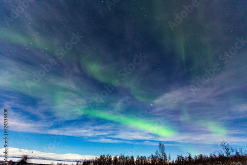 Northern Lights in Lapland. in Abisko in Sweden. Colors in the sky and in the snow © Claudio Quacquarelli