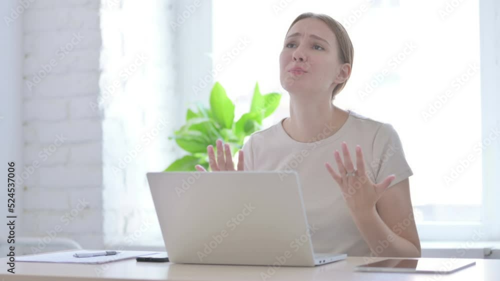 Woman Reacting to Financial Loss While using Laptop Woman Reacting to Financial Loss While using Laptop