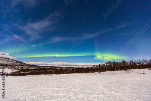 Aurora boreale. Notte di luci nel cielo ad Abisko in Svezia photo