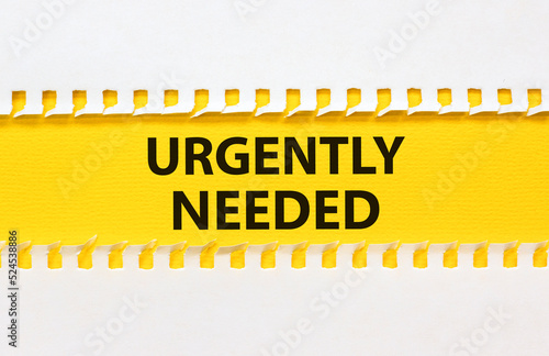 Urgently needed symbol. Concept words Urgently needed on yellow paper on a beautiful white background. Business and urgently needed concept. Copy space.