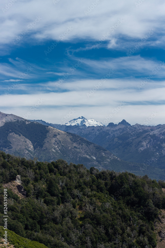 Amazing panoramic of a mountain and clouds in San Carlos de Bariloche, Argentina, Patagonia, South America. Vertical Amazing panoramic of a mountain and clouds in San Carlos de Bariloche, Argentina, Patagonia, South America. Vertical