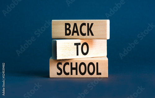 Back to school and support symbol. Concept words Back to school on wooden blocks. Beautiful grey table grey background. Business, educational Back to school concept. Copy space.