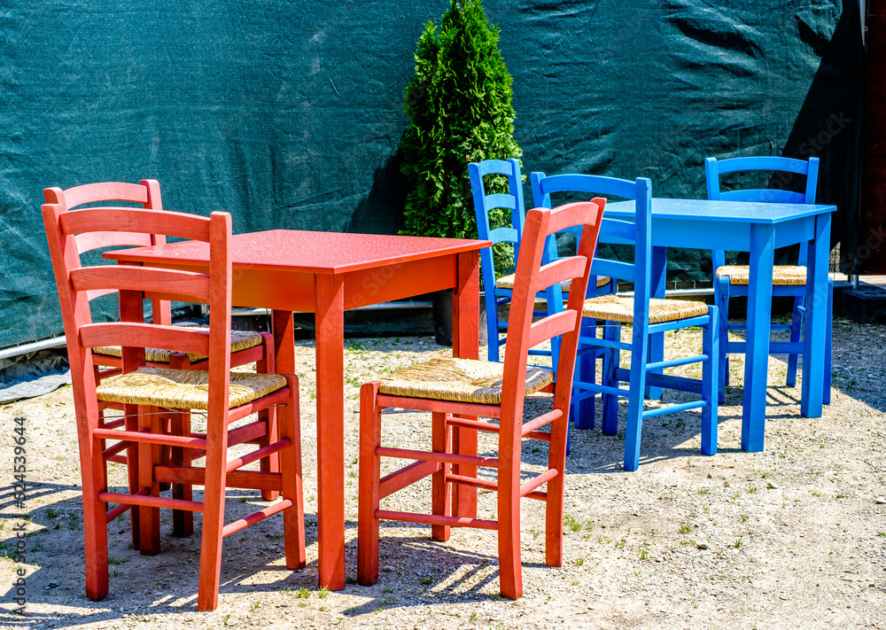 table and chairs at a sidewalk cafe