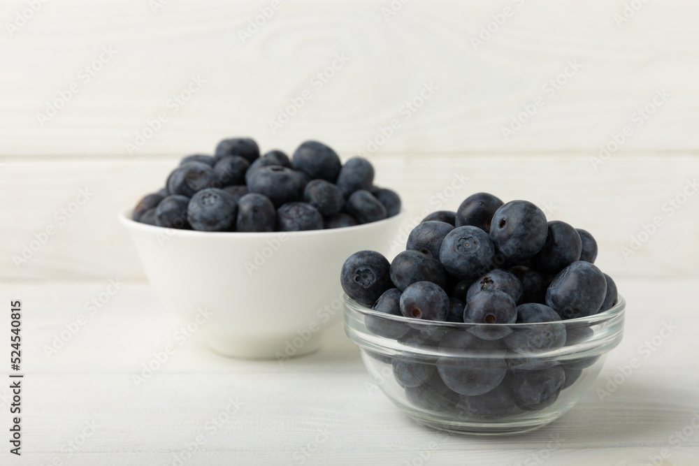 Blueberries in a bowl on white textured background. Ripe and fresh blueberries. Vitamins. Healthy food. Juicy berry.Copy space.Place for text Blueberries in a bowl on white textured background. Ripe and fresh blueberries. Vitamins. Healthy food. Juicy berry.Copy space.Place for text