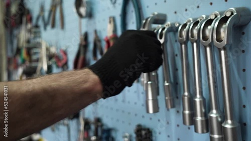 auto mechanic takes a working tool for car repair