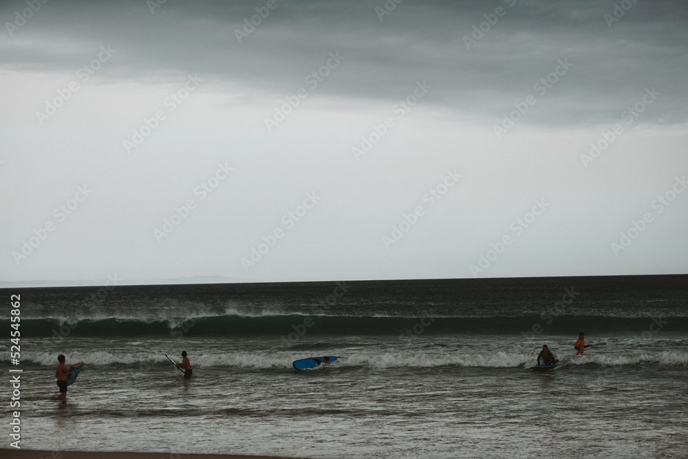Naklejka premium surfer on the beach