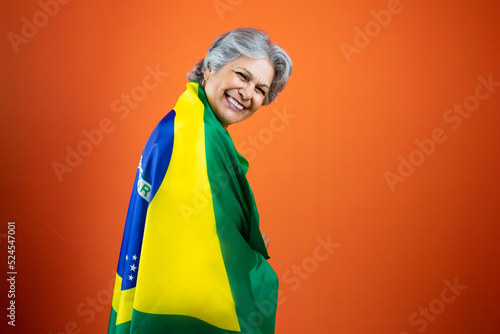  September 7th, Brazil's Independence Day - Mature Woman with Gray Hare Holding Brazil Flag
