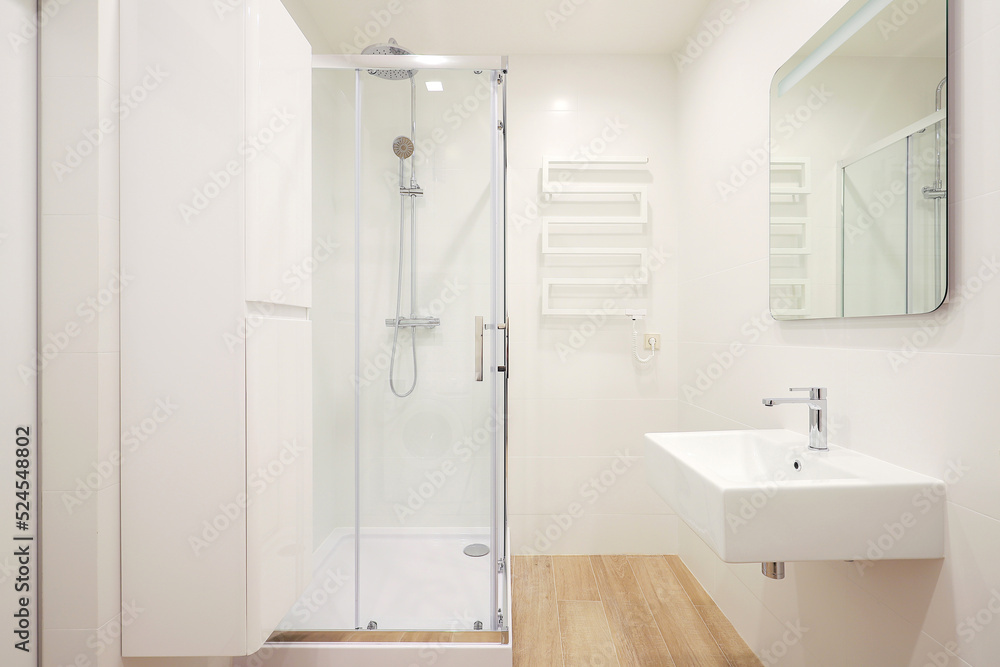 Modern bathroom interior with shower cabin and washbasin Modern bathroom interior with shower cabin and washbasin