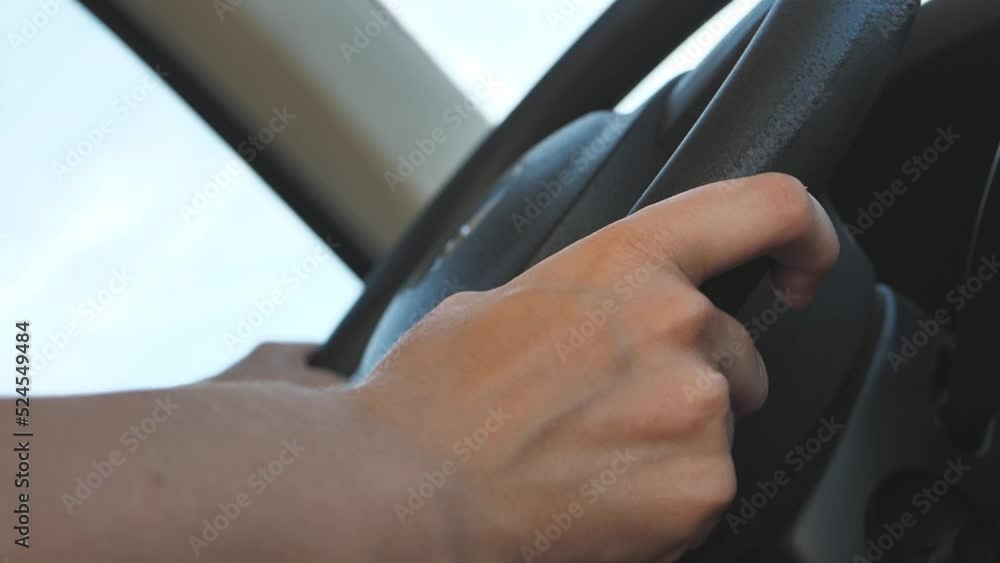 Using Windshield Wiper Car Wheel. Woman Driver Hand On Car Steering Wheels. Transport Driver Turning Steering Wheel Car. Business woman driving a car. Using Windshield Wiper Car Wheel. Woman Driver Hand On Car Steering Wheels. Transport Driver Turning Steering Wheel Car. Business woman driving a car.