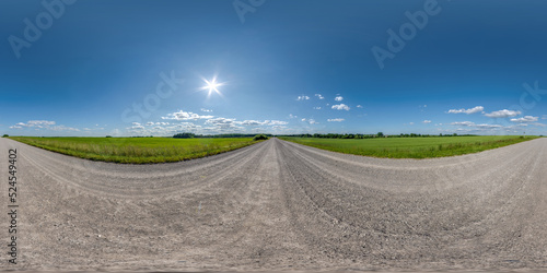 360 hdri panorama on no traffic gravel dusty white sand road among fields with fluffy clouds in full seamless spherical equirectangular projection, may use like sky replacement for drone panorama