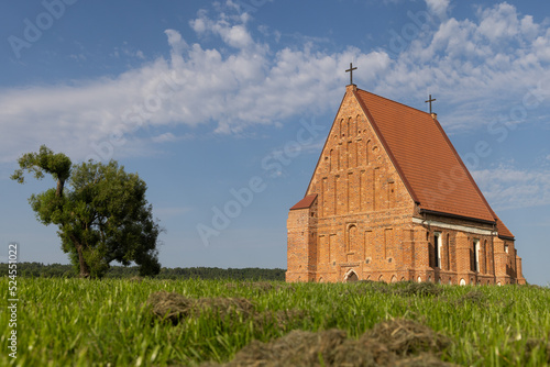 Zapyskis, Lithuania July 20 2022: early Gothic red brick church (built between 1530 and 1578) In Lithuania, Zapyskis, Kaunas district. photo