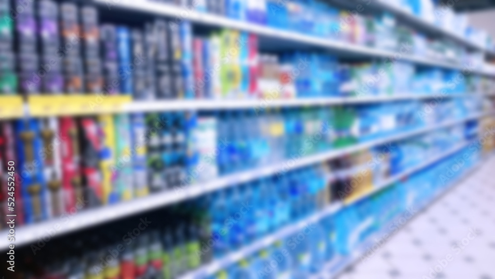 Abstract blur image of supermarket background. Defocused shelves with products. Grocery store. Retail industry. Rack. Discount. Inflation concept. Aisle. Consumer packaged goods. CPG. Shopping.