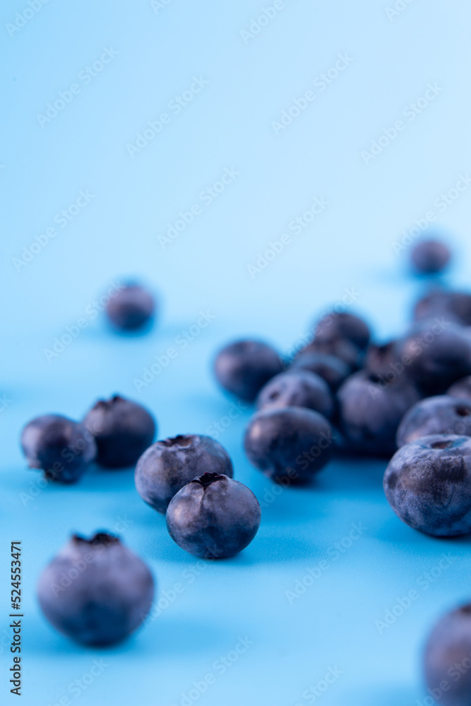 Blueberry isolated on blue. Blueberry top view flatlay with copyspace. Vegan and vegetarian concept. Summer healthy food. Blueberry isolated on blue. Blueberry top view flatlay with copyspace. Vegan and vegetarian concept. Summer healthy food.