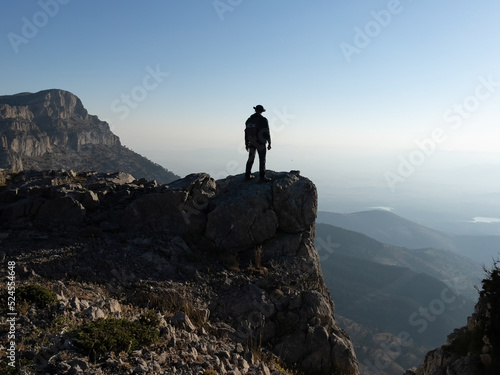 the joy of victory and success of the mountaineer reaching the peaks of the high mountains