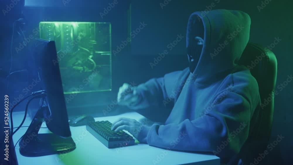 Cybercriminal hacker typing and rejoicing. High quality 4k footage