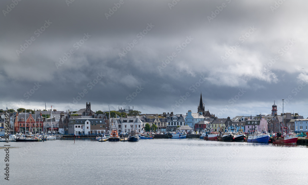 Naklejka premium 18 August 2022. Stornoway, Isle of Lewis, Highlands and Islands, Scotland. This is a scene of Stornoway Harbour on an August morning as rain clouds started to break up.
