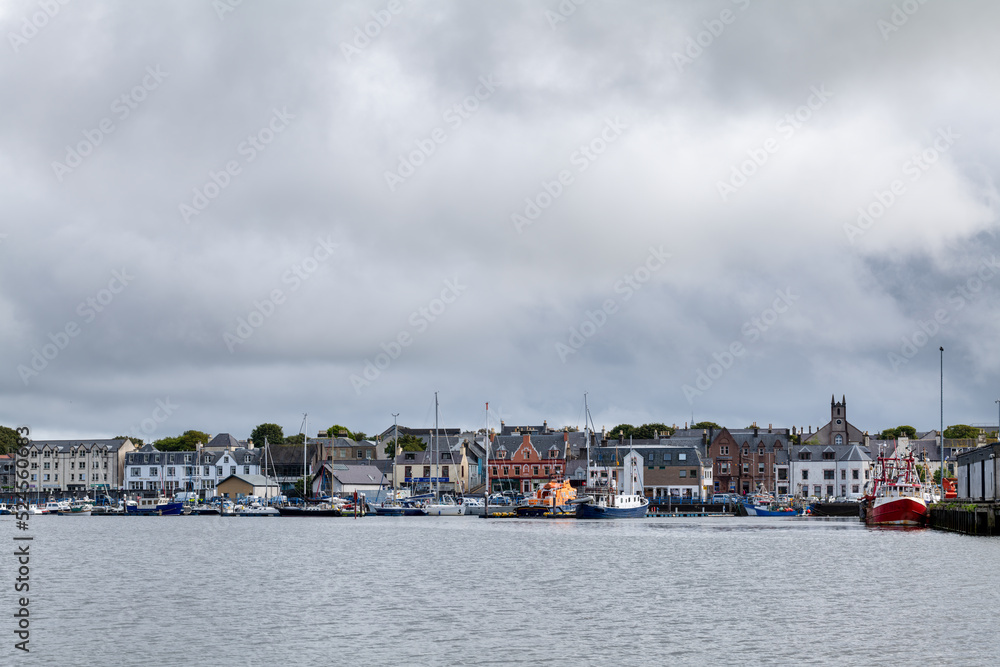 Naklejka premium 18 August 2022. Stornoway, Isle of Lewis, Highlands and Islands, Scotland. This is a scene of Stornoway Harbour on an August morning as rain clouds started to break up.
