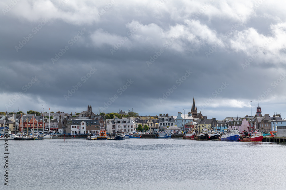 18 August 2022. Stornoway, Isle of Lewis, Highlands and Islands, Scotland. This is a scene of Stornoway Harbour on an August morning as rain clouds started to break up.