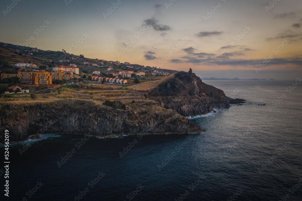 Coastline of Canico de Baixo and Reduto do Portinho rocks at sunrise. Madeira, october 2021. Aerial drone picture