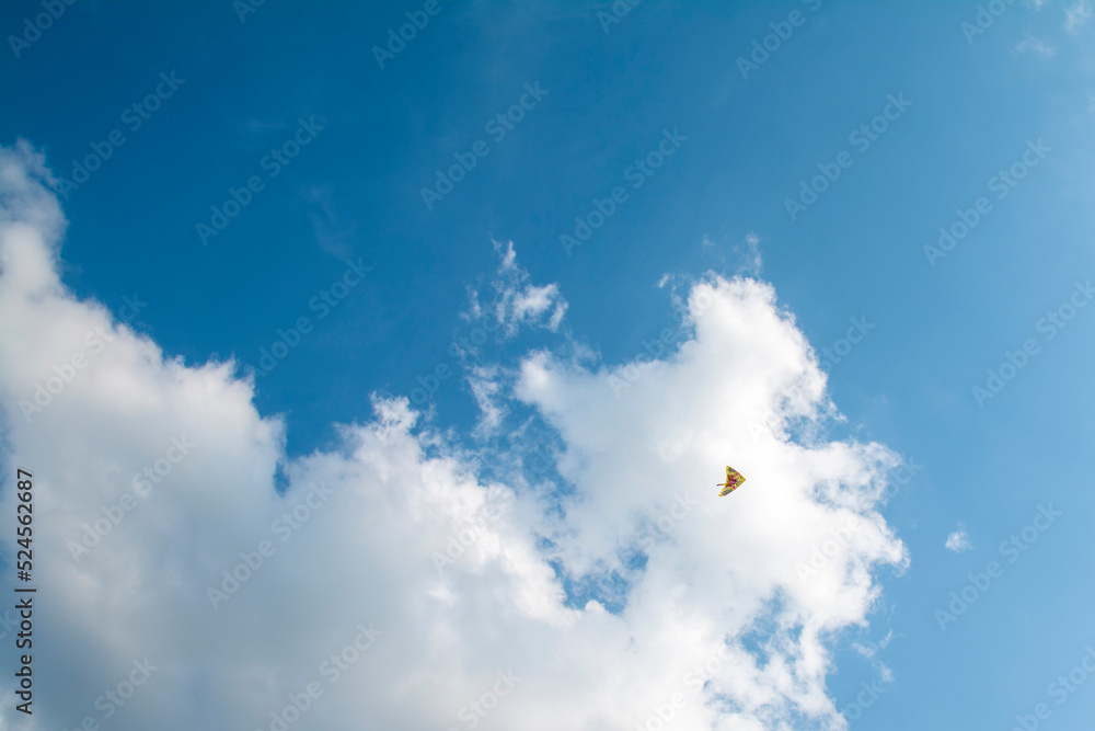 wind kite flying in the blue sky wind kite flying in the blue sky