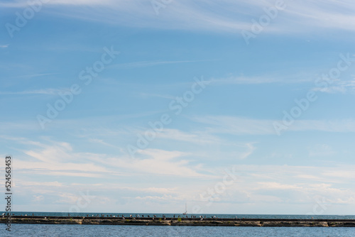 view of the lake with clouds in the sky © eugen