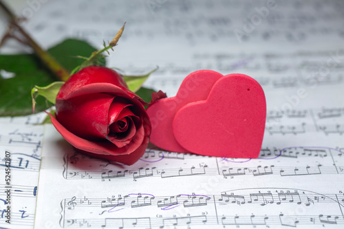 Musical notes and red rose