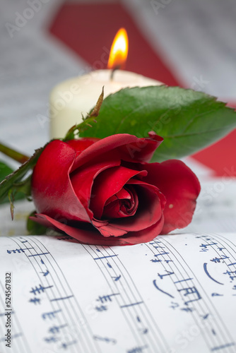 Musical notes and red rose