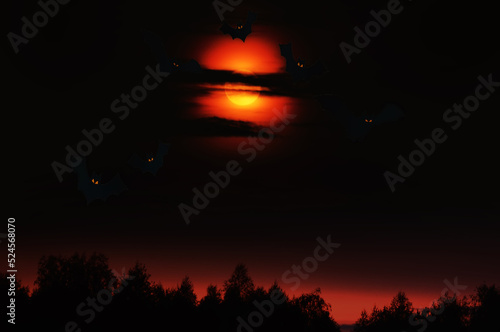 Gloomy dramatic sky and silhouettes of bats. celebration of Halloween.