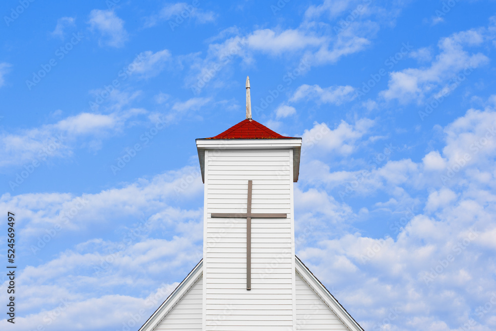 Christian church steeple and blue sky with copy space