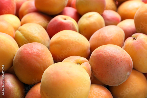 Delicious fresh ripe apricots as background  closeup