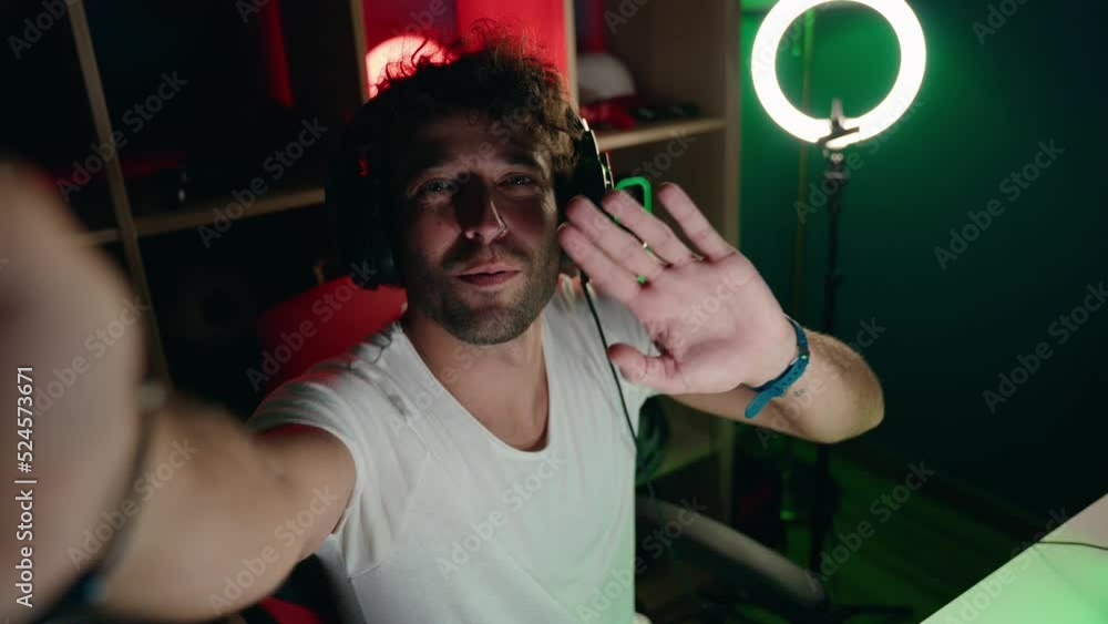 Young hispanic man streamer having video call at music studio Young hispanic man streamer having video call at music studio