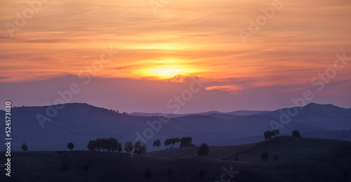 Wallpaper Mural Picturesque sunset in the countryside, hills on the horizon Torontodigital.ca