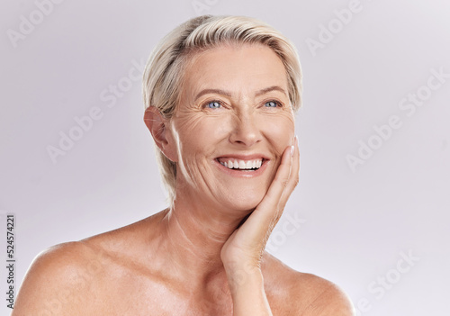 Skincare  grooming and beauty with a mature woman happy with her skin after a facial or treatment. Senior female feeling confident and relaxed  enjoying selfcare routine and healthy  natural texture