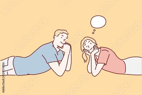 A happy couple lying on the floor is thinking about something. hand drawn style vector design illustrations.