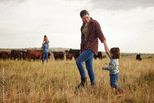 Fotografie, Tablou Sustainable farming family, cows on agriculture farm with rustic, countryside or nature grass background