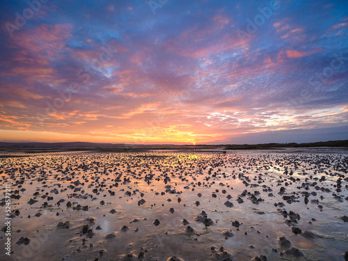 Sunset reflections at Holy Island at low tide