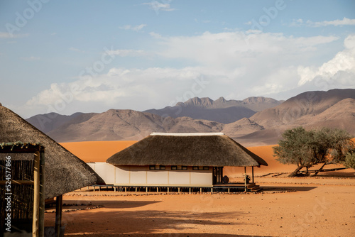 thatched roof on resort buildings in the desert of namibia