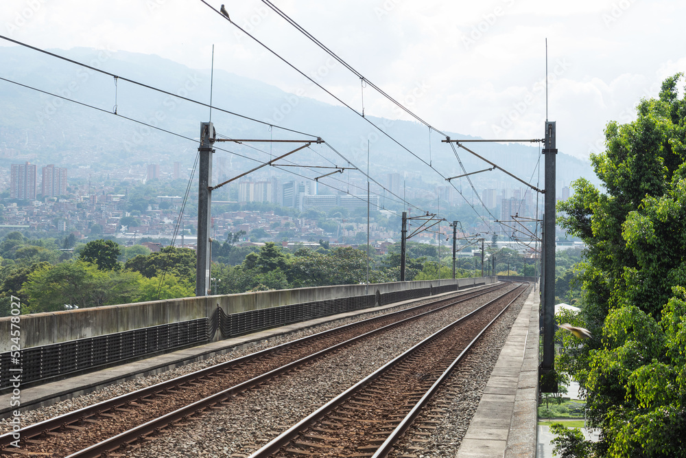 Metro rails with Medellin, Colombia in the background Metro rails with Medellin, Colombia in the background
